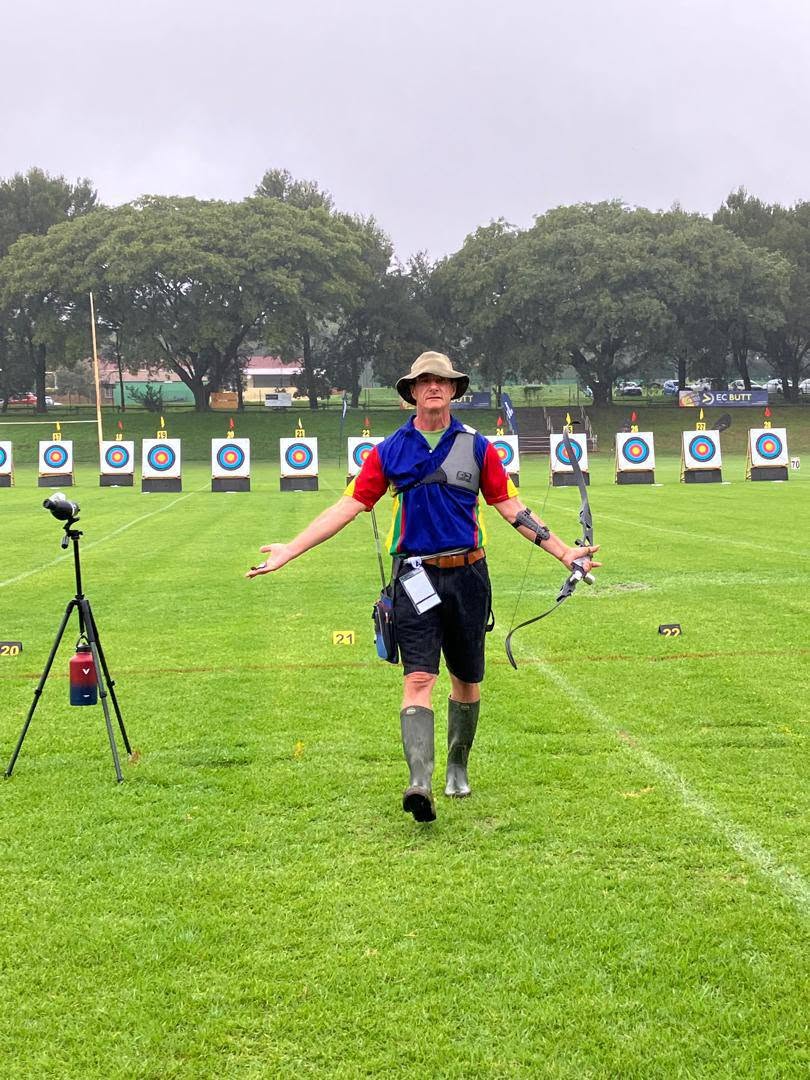 Archer on a target archery field with a line of targets behind